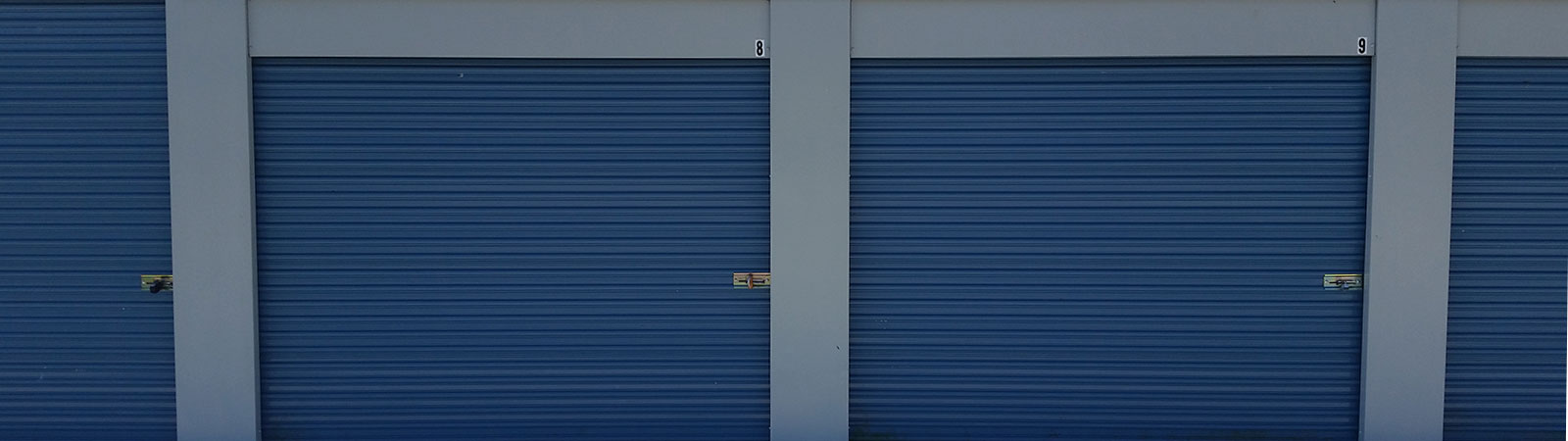 line of overhead doors on storage units